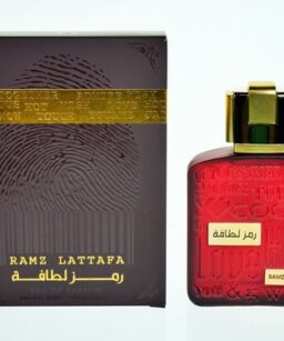 Lattafa Ramz Gold perfume for women with elegant red bottle and gold accents.
