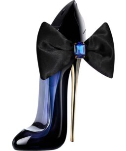 Elegant perfume bottle with a black bow and blue gemstone detail.